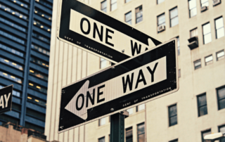 sign pointing two ways - commercial property appraiser career choice concept